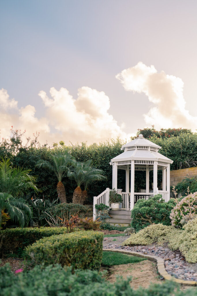 gazebo in beautiful garden with ombre skies