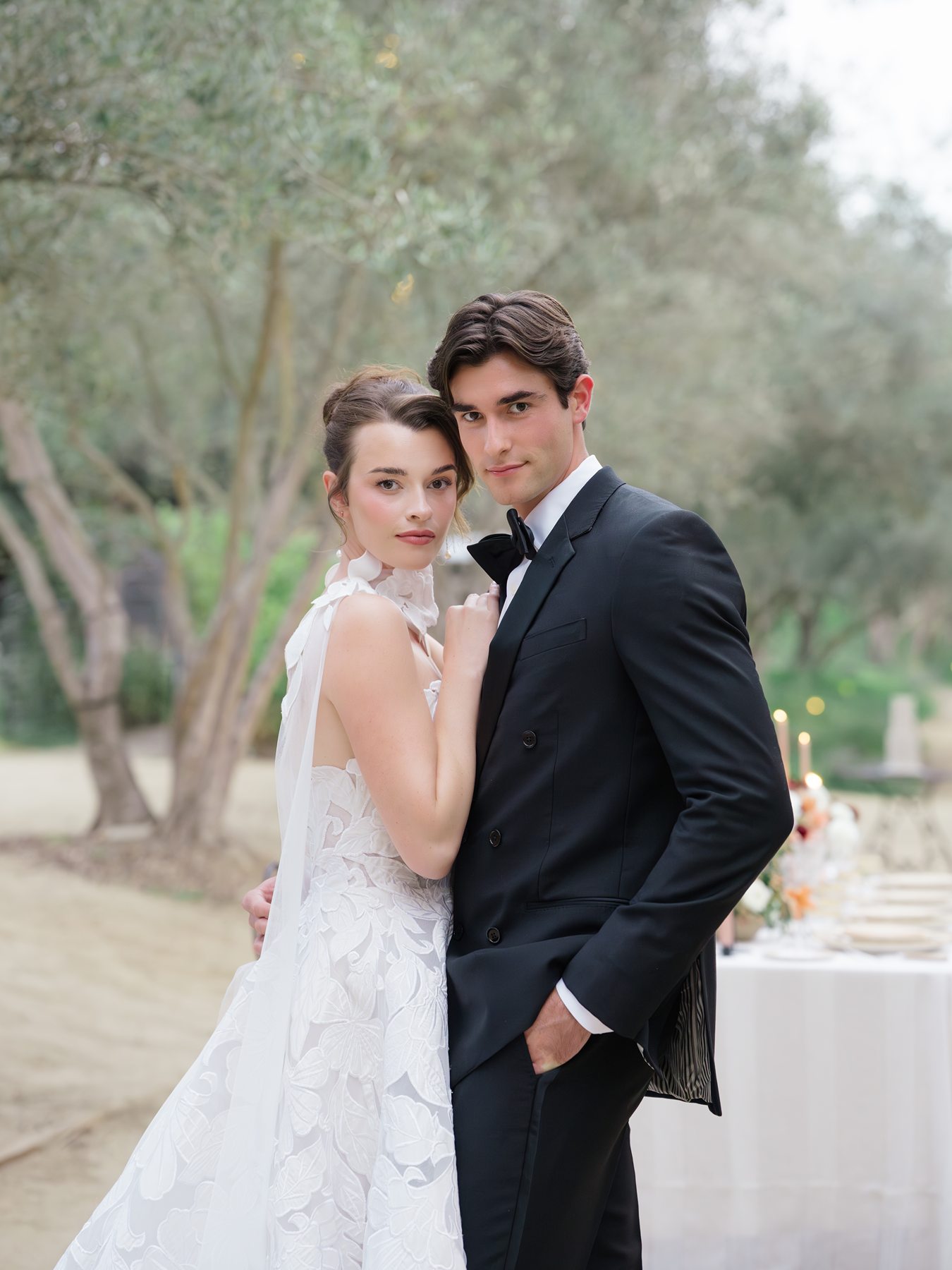 Couple posing at elegant outdoor wedding in Rancho Valencia Resort and Spa